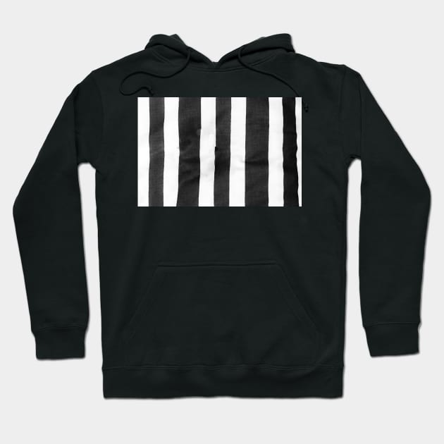 Black and white striped cloth laid out roughly to provide vetical blank lines. Hoodie by brians101